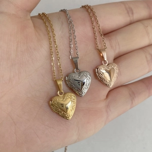 Three-tone heart locket necklaces in gold, silver, and rose gold with floral engraving