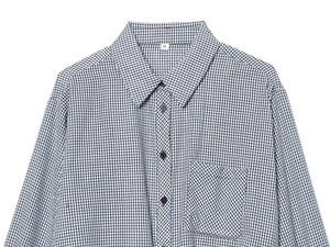 Detail of black and white checkered shirt showing button placket and chest pocket