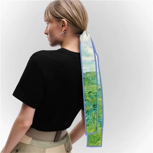 Detailed view of an oil painting style silk scarf used as an elegant hair ribbon tie