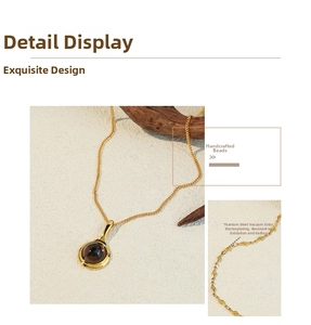 Detail of beaded necklace with gold titanium plating and brown amber-like pendant