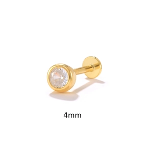 Macro detail of a 4mm gold S925 sterling silver stud with a round clear zircon stone