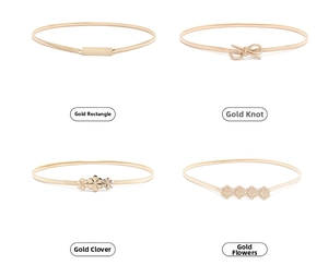 Detail view of four gold metal elastic thin belts with different decorative buckle styles