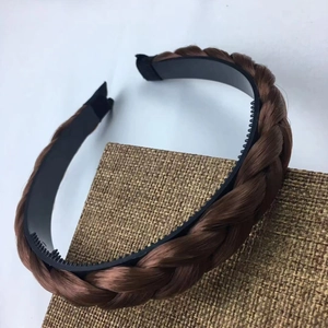 Detail of dark brown braided hair headband featuring anti-slip inner teeth structure