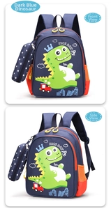 Detail of kids backpack with dinosaur print, orange mesh pocket and star pendant