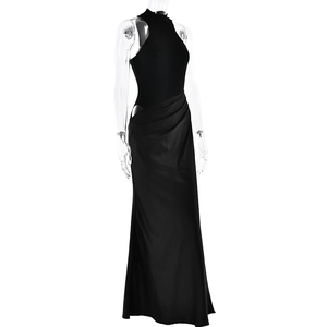 Close-up of side cutout and ruched detailing on this black sleeveless maxi dress