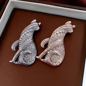 Minimalist cat brooches with woven texture in silver and rose gold metallic finishes