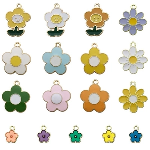 Close-up of colorful enamel flower pendants with gold plating and smiley face details