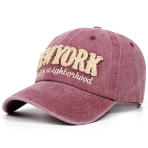 Close-up of vintage washed burgundy baseball cap with New York Brooklyn embroidery