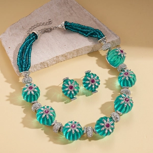 Floral beaded necklace and earring set with teal resin beads and pink rhinestones