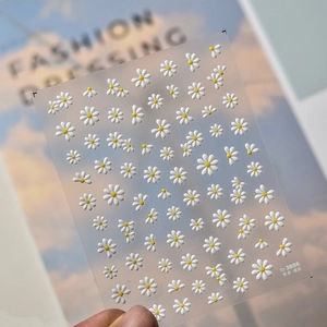 Macro detail of 3D jelly daisy nail art stickers featuring cute white and yellow flowers