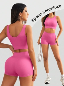 Detail of hot pink ribbed seamless yoga set showing wide waistband and U-neck sports bra
