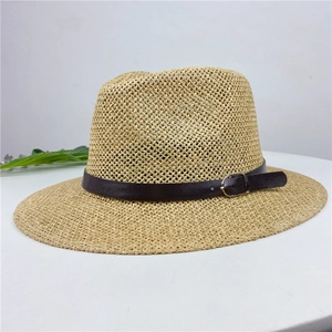 Detailed close-up of a woven straw fedora featuring a brown leather strap and metal buckle