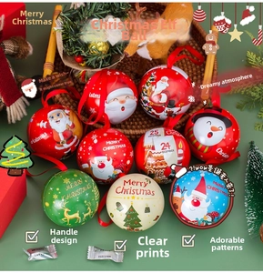 Detailed view of spherical tinplate Christmas gift boxes with festive holiday patterns