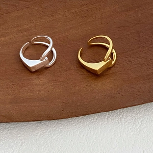 Close-up of geometric minimalist S925 sterling silver open rings in gold and silver finish