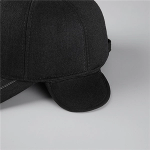 Detail showing high-quality stitching and wool texture on black winter earflap hat