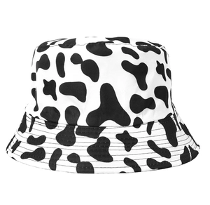 Close-up of the black and white cow print bucket hat showing fabric texture and stitching