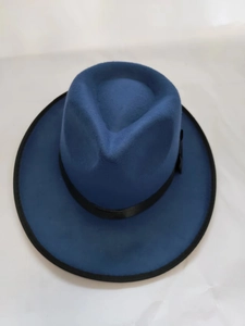 Flat lay view of navy blue wool fedora hat with black satin ribbon and wide brim