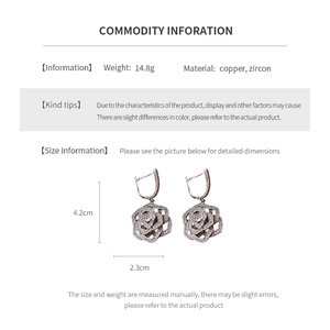 Detailed view of silver rose earrings with zircons showing dimensions and product specs