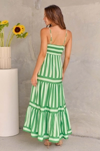Detail view of the multi-layered skirt and green striped pattern on the back of the maxi dress