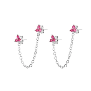 Detail of flower cluster chain earrings with pink zircon stones and silver plating