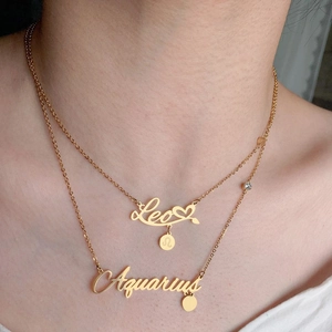 Layered gold stainless steel necklaces with Leo and Aquarius zodiac letter pendants