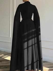 Elegant black pleated chiffon jumpsuit with long cape sleeves shown in a back view pose