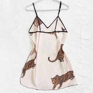 Elegant champagne satin nightdress with leopard print and pearl hanger display