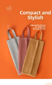 Detailed view of collapsible waterproof travel bags in gray, rose, and ginger colors