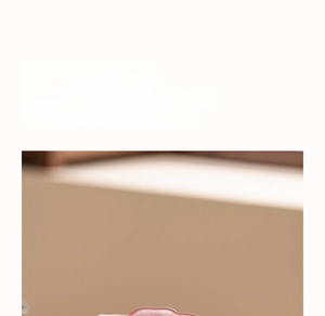 Detailed view of pink glazed Dehua white porcelain teacup with elegant smooth texture