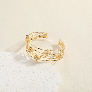 Elegant gold layered snake snake open cuff bracelet with sparkling clover flower charms