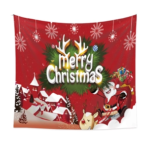Detail of red Christmas tapestry showing Merry Christmas text and reindeer sleigh