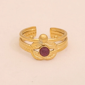 Close-up of gold adjustable ring with round purple natural stone and braided texture
