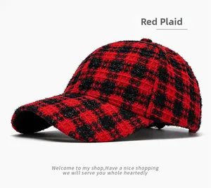 Close-up of red and black grid plaid baseball cap with thick textured knit fabric