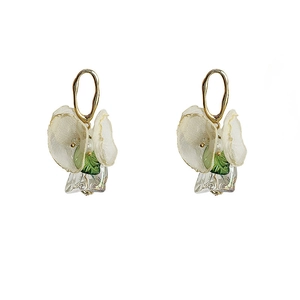 Elegant 14K gold plated flower earrings with creamy petals and green leaf accents