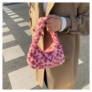 Close-up of pink leopard print faux fur handbag styled with a classic autumn trench coat