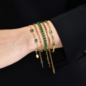 Gold layered bracelet set with green zircon stones and snake chain for women