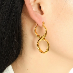 Chic twisted infinity gold hoop earrings in polished stainless steel for women