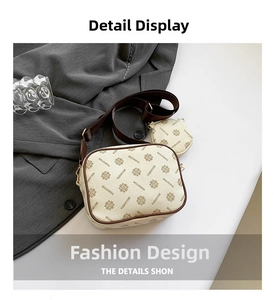Detail of cream camera bag with monogram pattern and matching round coin purse