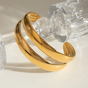 Polished gold double-layered open bangle bracelet for women in a minimalist design