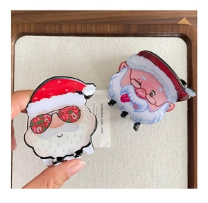 Detail of cute Santa Claus hair claws with leopard sunglasses and classic smiling face
