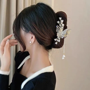 Elegant gold butterfly hair claw clip with long pearl tassels and lily decoration