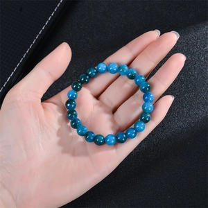 Natural apatite beaded stretch bracelet with blue gemstone beads worn on wrist