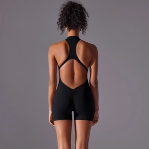 Detail of black backless sports jumpsuit with racerback design and scrunch butt feature