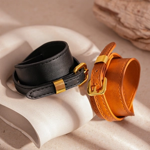 Retro faux leather wrap bracelets in black and brown with gold buckle closures