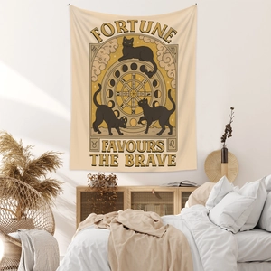 Detail of tarot style cat tapestry with Fortune Favours The Brave text on a cozy wall