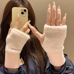 Detail of plush fingerless gloves in pink and white faux fur with knitted cuffs