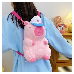 Pink plush Capybara backpack with blue hat and adjustable straps shown on model back