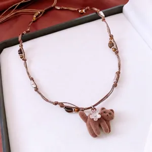 Collier perles œil de tigre avec pendentif chaton marron et détail fleur argentée