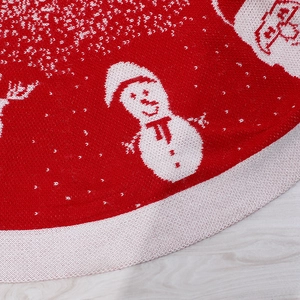 Red Christmas tree skirt featuring knitted snowman patterns and white borders