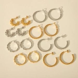 Collection of twist texture C-shaped hoop earrings in polished gold and silver finishes
